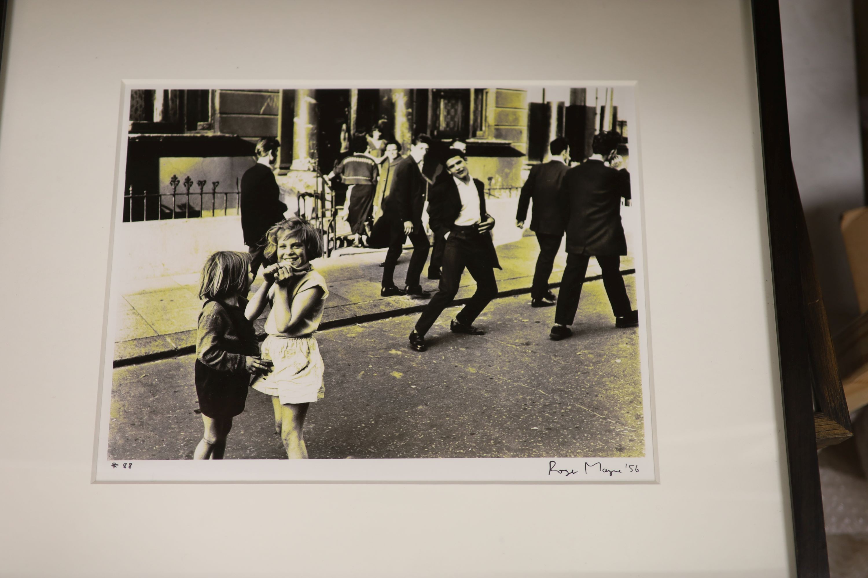 A collection of modern black and white photographs: Henk Jonker, Children and organ grinder, Roger Mayne, Please Mr Take My Photo, Unknown, The Village Hall, Christian Pizal